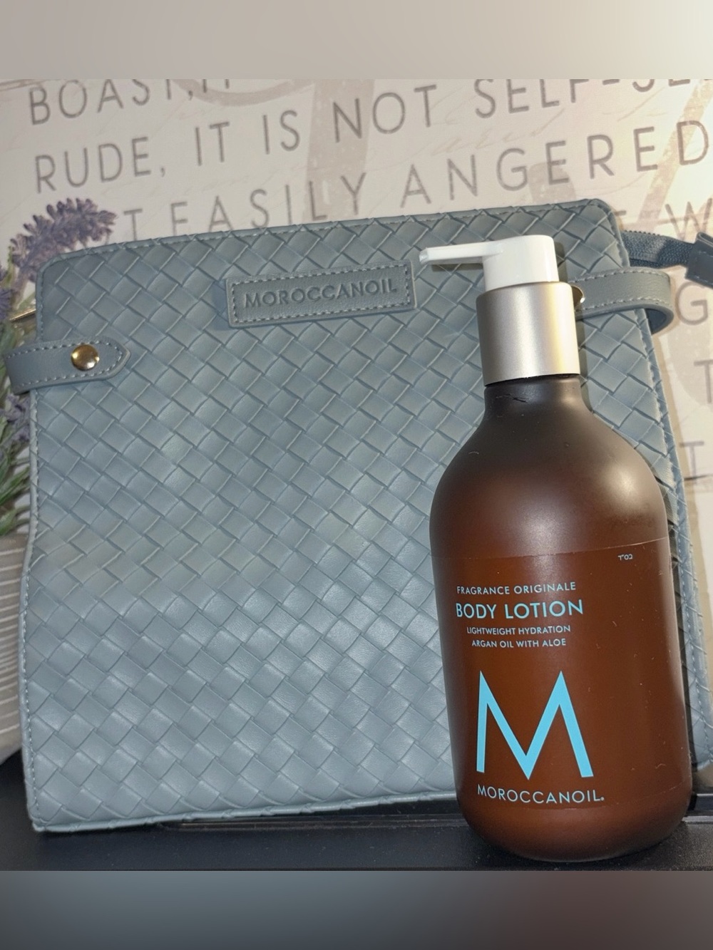 Moroccanoil Light Blue Woven Cosmetic Case & Bottle Body Lotion with M Logo.
